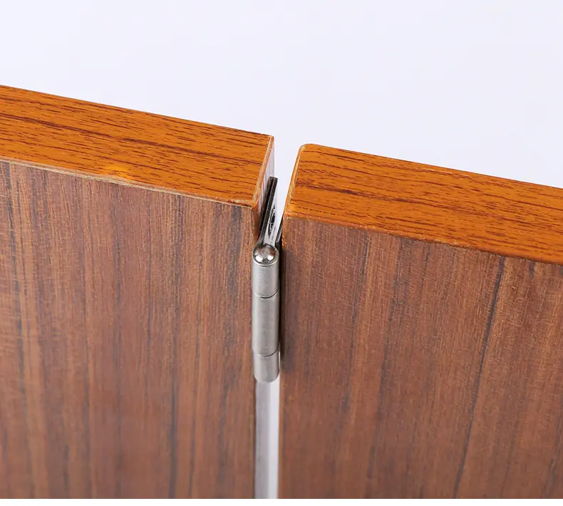 Detailed view of a mortise lock pocket and latch hole on a door edge