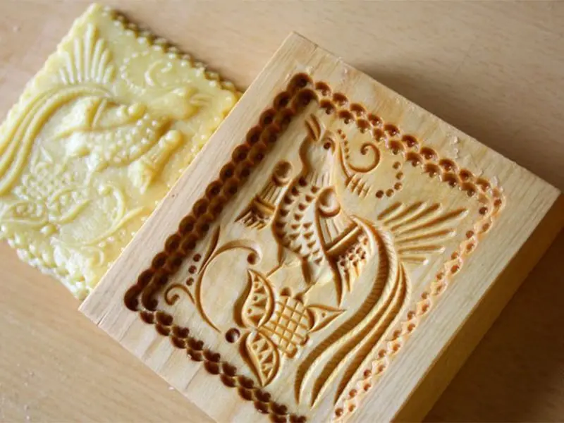 The smooth, flawless surface of a wooden mold directly off the CNC router, requiring minimal post-processing