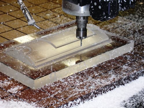 A CNC router can cut acrylic sheets.