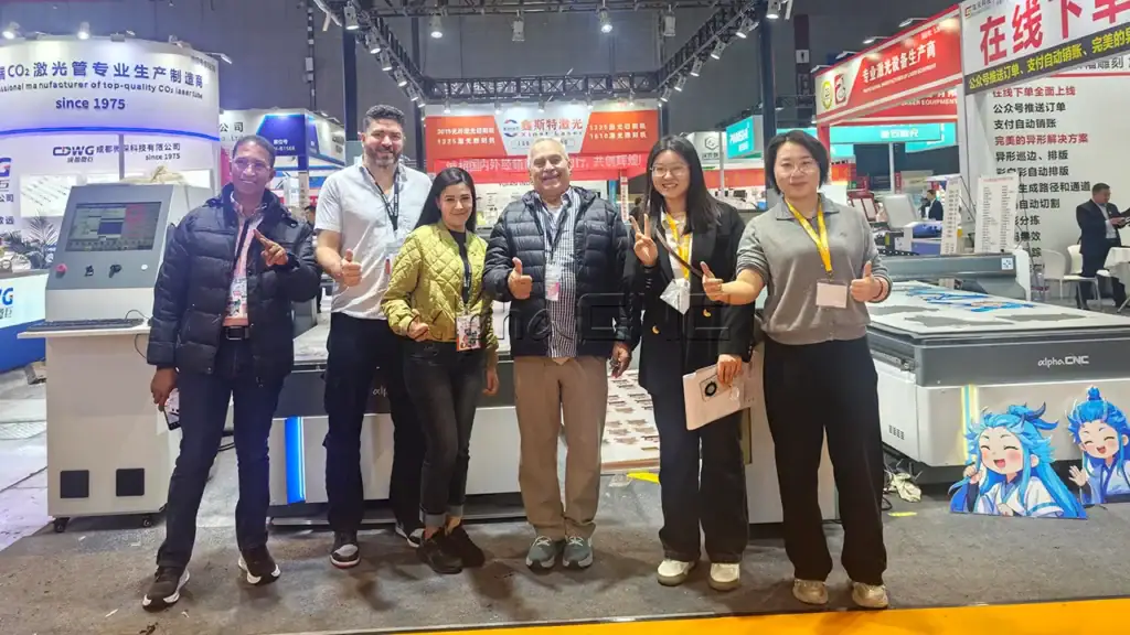 Alpha CNC team with global buyers at woodworking machine exhibition