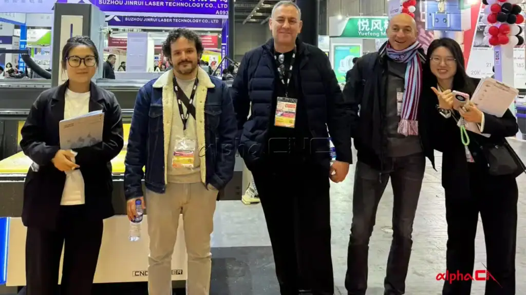 Alpha CNC team with overseas customers at woodworking machine exhibition