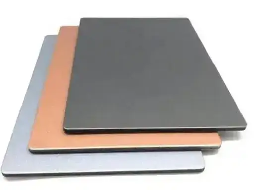 Aluminum composite panel with routed grooves and cutouts