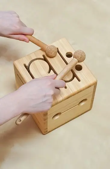 Complex scrollwork and sound holes cut into body using a CNC cutting machine