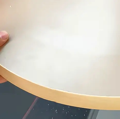 Close-up of invisible seam on manual edge banding machine finished product