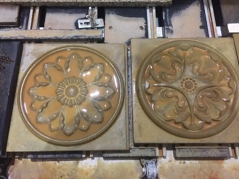 Close-up detail of a custom ogee edge profile on a marble countertop, finished with a CNC polishing head