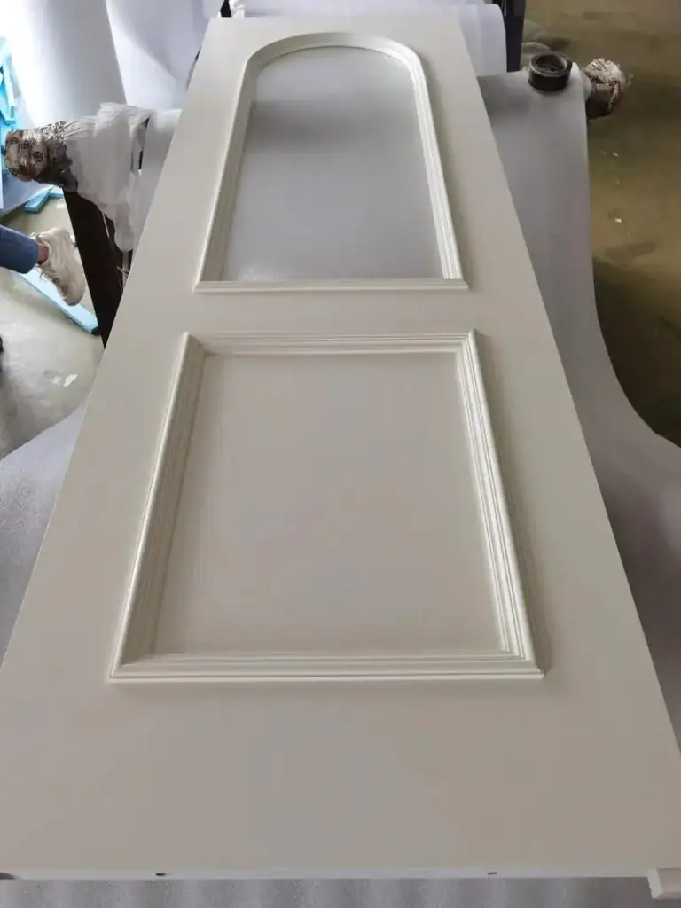 A collection of smooth-edged cabinet components machined from wood, demonstrating the router's capability for panel furniture production.