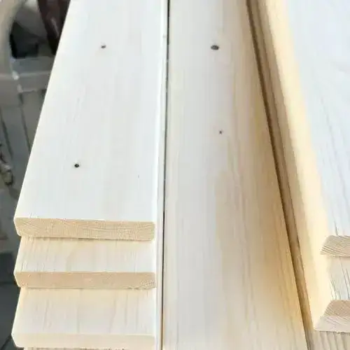 Close-up result of a cut on melamine-coated board, showing a sharp edge with no surface chipping.