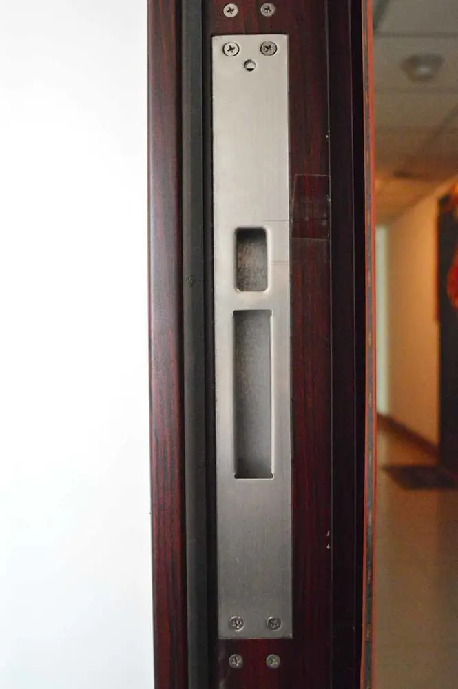 Multiple hinge recesses drilled and routed on a door frame