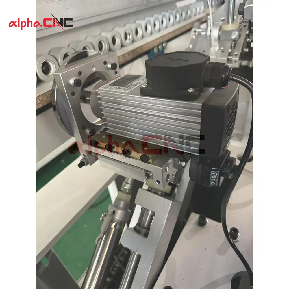 Close-up detail of the CNC edge bander's contour copying wheel and system, ensuring perfect edge application on any workpiece shape.