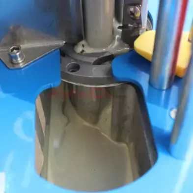 Edge band material being pressed and sealed with precision glue application