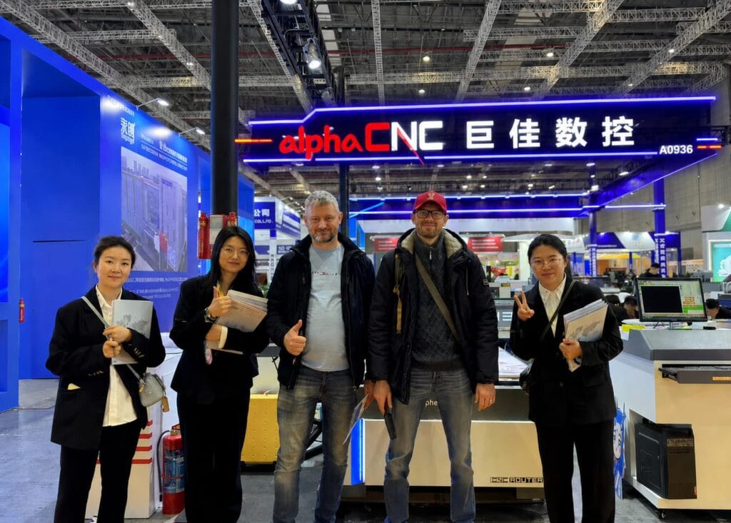 A photo of Alpha CNC and a customer at the exhibition.