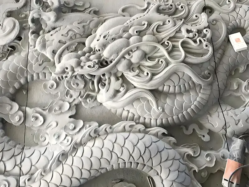 A detailed granite lion sculpture for garden decor, showcasing the precision of CNC routing for hard stone