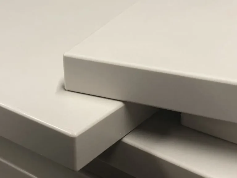 High-gloss white PVC edge banding sample seamlessly applied to panel
