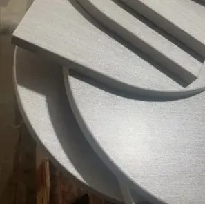 Close-up view of a perfect edge banding on a sharp corner, achieved with the all-in-one polishing machine