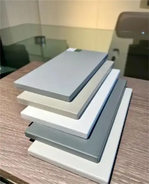 A modern office desk with a perfectly curved and banded edge, demonstrating postforming capabilities of a fully automatic edge bander