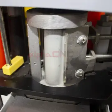 Close-up of adhesive system on manual edge banding machine for secure bonding