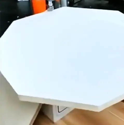 Flawless edge banding result on a circular wood table top with seamless finish