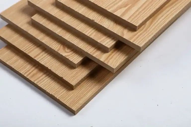 Close-up sample of a plywood panel edge, cut cleanly with no chips or tear-out, demonstrating saw blade quality