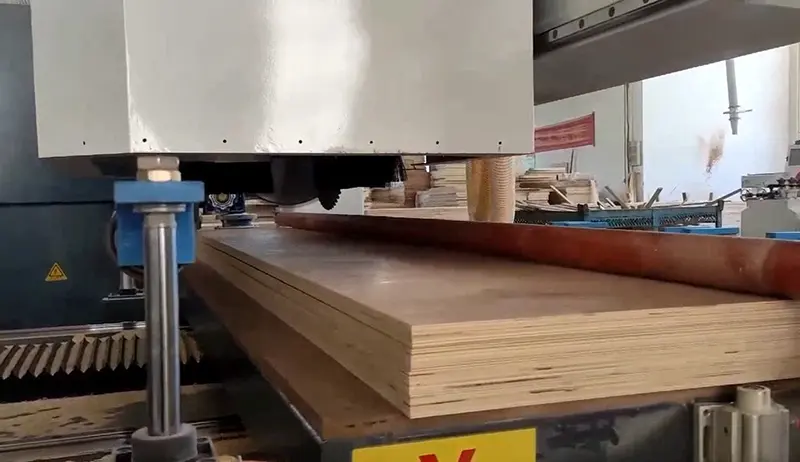 CNC Beam Saw Machine During Wood Panel Cutting Process